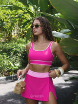 Hot pink swim skort set, three-quarter front view on model | Covera