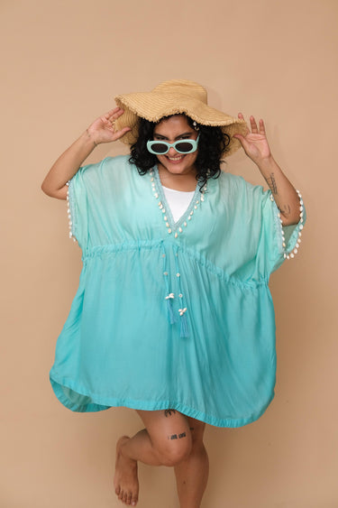 Woman wearing a turquoise cover-up