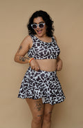 Woman wearing a cow print outfit