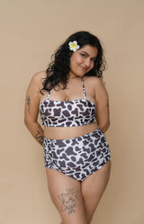 Woman wearing a cow print bikini set