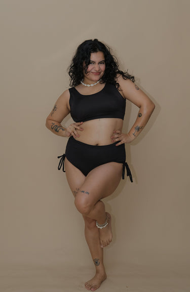 Woman wearing a black bikini set