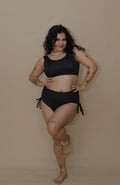 Woman wearing a black bikini set