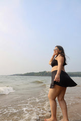 Woman in a black swimsuit