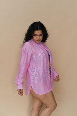 Plus size woman wearing a pink tie-dye shirt