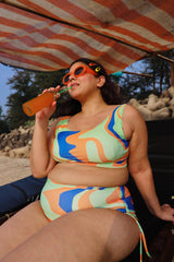 Plus size woman in colorful swimsuit