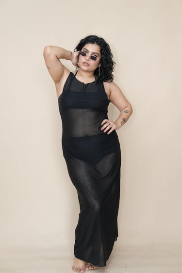 Plus size woman wearing a black sheer dress