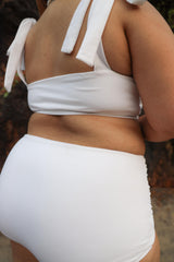 Curvy woman wearing white bikini