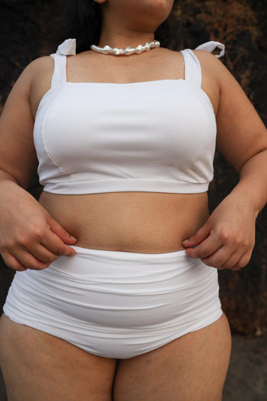 Woman wearing a white bikini set
