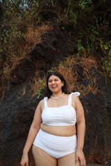 Woman wearing a white bikini set