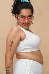 Woman wearing a white top and bottom