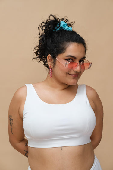 Woman wearing a white tank top
