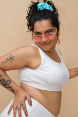 Woman wearing a white tank top
