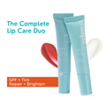 Two blue lip care products with a red applicator on a white background, labeled 'The Complete Lip Care Duo'.