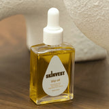 Skinvest slip oil bottle with dropper on a wooden surface