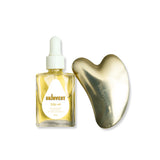SKINVEST slip oil bottle and Gua Sha tool on a white background