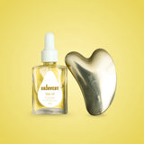 SKINVEST skincare product with a dropper bottle and Gua Sha tool on a yellow background
