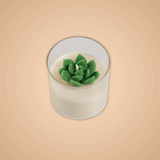 Candle with a green succulent-shaped wick on a beige background