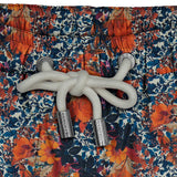 House of Malabaar boy's swim shorts with a fall foliage print.