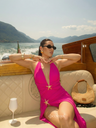 Hot pink starfish monokini with matching skirt worn on luxury boat