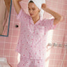 Pink stripe heart cotton nightsuit worn by model standing indoors – women’s sleepwear