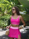 Hot pink swim skort set, three-quarter front view on model | Covera