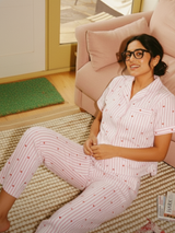 Close-up of pink striped waffle cotton fabric with heart motifs – women’s sleepwear