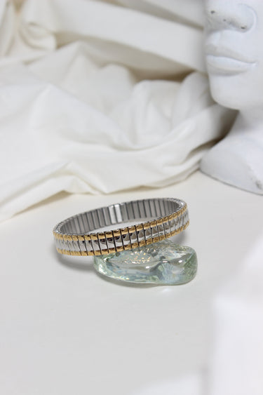 Dual Harmony Bracelet on a white fabric background