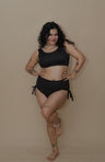 Woman wearing a black bikini set