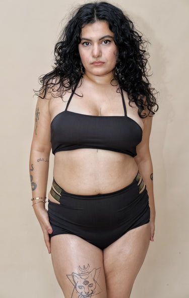 Woman wearing a black bikini set
