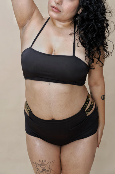 Woman wearing a black bikini set