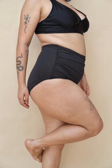 Curvy woman wearing a black bikini set