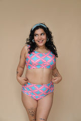 Woman wearing a pink and blue patterned bikini set 