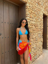 Multicolor mini sarong styled over bikini – women’s resortwear