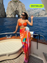 Pina Colada printed sarong styled as beach cover-up on boat – women’s resortwear