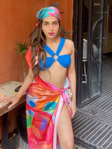 Multicolor printed sarong worn as skirt styling – women’s resortwear