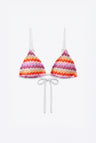 A two-piece triangle bikini set with a vibrant chevron pattern in pink, orange, purple, and white, featuring white strings and thin shoulder straps, displayed on a clean white background.