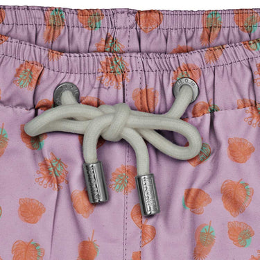 House of Malabaar pink boy's swim shorts with playful print of tropical leaves.